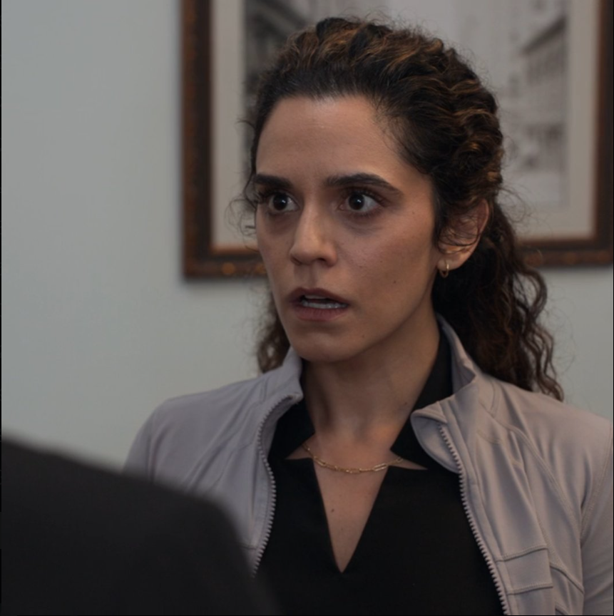 1. Her expression indicates she has just processed the rather startling information that the wall behind her is, indeed, a wall. And it's not going anywhere. 2. It seems she has just encountered a particularly unyielding metaphorical wall, or perhaps the literal wall has simply refused to entertain her suggestions. 3. One might infer she has just realized the profound irony of a wall displaying an image of other walls. The layers of enclosure can be quite disorienting.