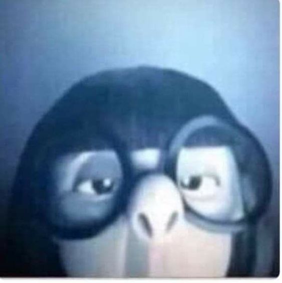 This image captures a close-up of Skipper from the 'Penguins of Madagascar' franchise, showcasing his iconic and highly meme-able side-eye expression. His demeanor is one of intense suspicion and judgment, as if he's scrutinizing something off-camera with profound skepticism. The cartoon penguin's eyes are narrowed and angled, conveying a clear 'judging you' sentiment that has made this image a popular meme. The background is a simple, blurry blue, putting full emphasis on Skipper's comically critical gaze. The humor lies in the anthropomorphic intensity of a penguin's unimpressed stare, perfectly embodying the feeling of being silently evaluated.