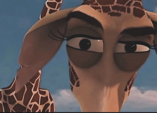The image features a close-up of Melman the giraffe from DreamWorks' 'Madagascar' franchise, giving his iconic, highly unimpressed side-eye. His large, dark eyes are narrowed, with long, delicate eyelashes adding a touch of exaggerated drama to his skeptical gaze. His slightly furrowed brows convey a humorous sense of mild exasperation or judgment, a demeanor widely recognized as a popular reaction meme. The background is a soft, clear blue sky with hints of white clouds, suggesting an expansive outdoor setting, possibly a savanna or a tropical location, fitting the adventurous context of the 'Madagascar' films.