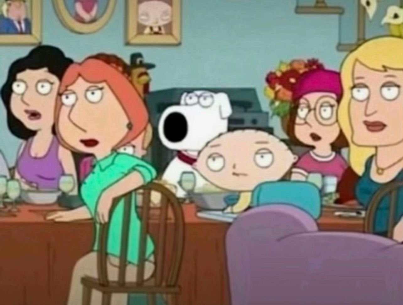 The image depicts a scene from the animated TV show 'Family Guy.' The setting is a dinner table where the Griffin family and their friends are seated. The characters display a range of humorous expressions, highlighting their quirky personalities. Lois Griffin, with her arms crossed, has an annoyed but exasperated demeanor, while Stewie, the baby, looks curiously intrigued. The background features a cozy dining room adorned with family portraits and a floral arrangement, adding to the familial atmosphere. The characters’ reactions suggest they are in the midst of an absurd conversation, typical of the show's satirical humor. The scene captures the essence of 'Family Guy,' where mundane moments often spiral into hilarity, showcasing the dynamic relationships among the characters.