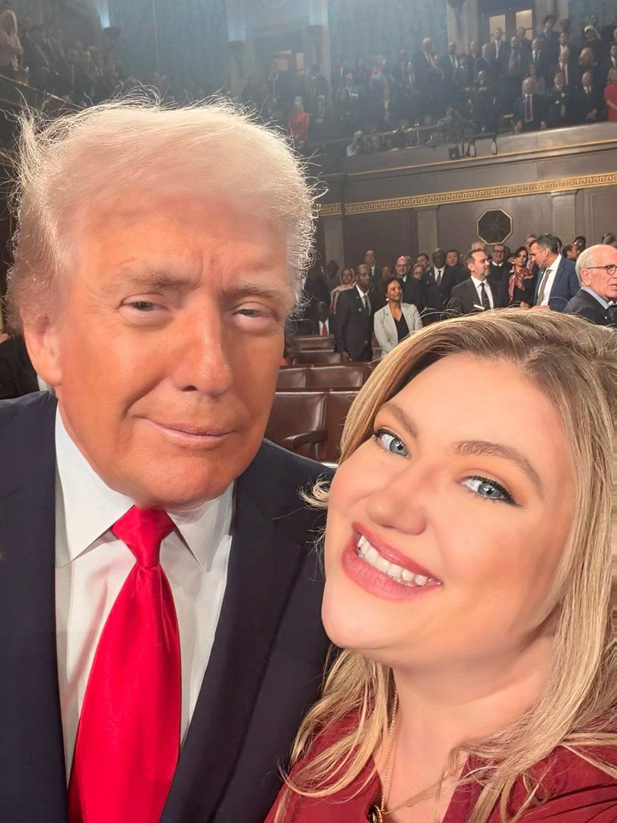 {
  "scene_summary": "two people taking a selfie",
  "reaction_anchors": [
    {
      "reaction": "smug",
      "intensity": "medium",
      "mismatch": "none",
      "confidence": 0.85
    },
    {
      "reaction": "overjoyed",
      "intensity": "high",
      "mismatch": "none",
      "confidence": 0.95
    }
  ],
  "posture_anchors": [
    {
      "posture": "stiff composure",
      "supports_reaction": "smug",
      "confidence": 0.85
    },
    {
      "posture": "wide-eyed smile",
      "supports_reaction": "overjoyed",
      "confidence": 0.95
    }
  ],
  "behavior_anchors": [
    {
      "behavior": "taking a selfie",
      "confidence": 0.95
    },
    {
      "behavior": "smiling broadly for camera",
      "confidence": 0.9
    },
    {
      "behavior": "posing with a smirk",
      "confidence": 0.85
    }
  ],
  "contradiction_anchors": [],
  "role_anchors": [
    "two people posing for a photo together"
  ],
  "contextual_anchors": [
    "large crowd in background observing"
  ],
  "text_in_image": [],
  "unknowns_or_ambiguous": [],
  "safety_notes": []
}