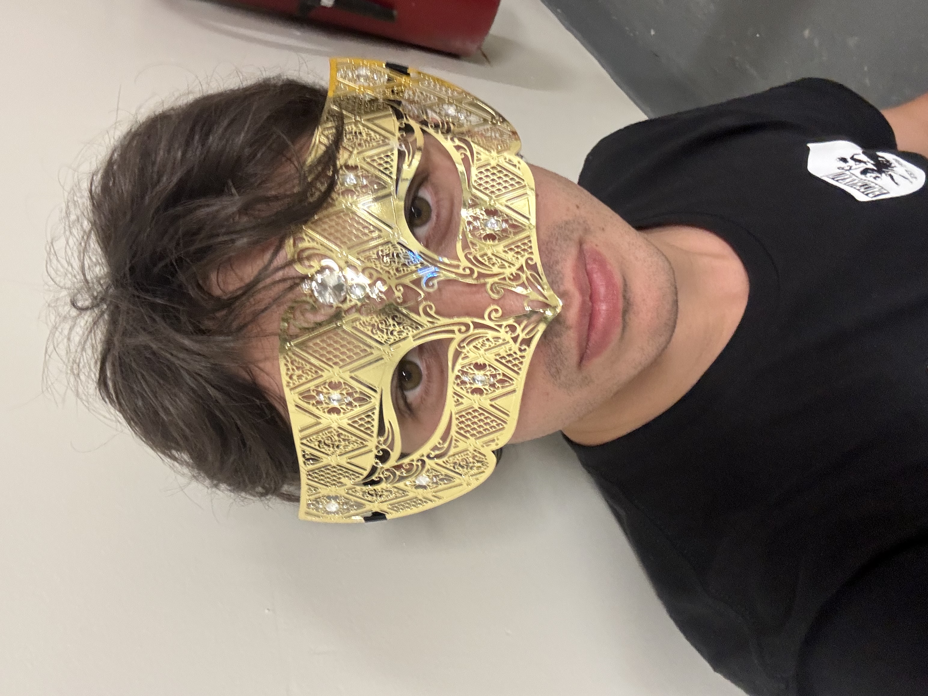 Casual t-shirt, fancy mask—who are you trying to fool?