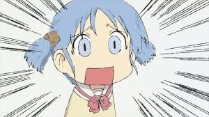 This image depicts an anime character, Nano Shinonome from "Nichijou: My Ordinary Life," with light blue hair tied in pigtails, wearing a school uniform with a pink bow. Her demeanor is one of extreme shock or surprise, conveyed by her wide-open blue eyes and a comically square-shaped open mouth. The background is stark white, featuring black radial lines emanating from behind her, a classic anime trope that dramatically emphasizes her sudden, intense reaction. This exaggerated expression is a well-known meme, highlighting the humorous, over-the-top reactions characteristic of the show. The background directly amplifies her bewildered state, making her the focal point of an unseen, startling event.