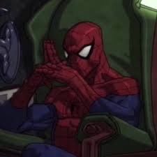 The image features Spider-Man, clad in his iconic red and blue suit, seated in a large, plush green armchair. He leans back, his masked head slightly tilted, with his hands clasped together in a classic 'evil mastermind' pose, fingers intertwined. His white eyes, usually expressive, here convey a deep, almost sinister contemplation, a humorous subversion of his usual heroic demeanor. The dark, indistinct background and the imposing chair suggest a secret lair or a very serious meeting, amplifying the comedic effect of Spider-Man seemingly plotting world domination. This pose is famously recognized as a meme from the *Ultimate Spider-Man* animated series, perfectly capturing a moment of unexpected villainous thought from our friendly neighborhood hero.