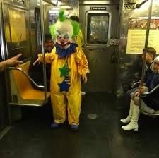 Clown crashing out on the train, yapping at strangers.