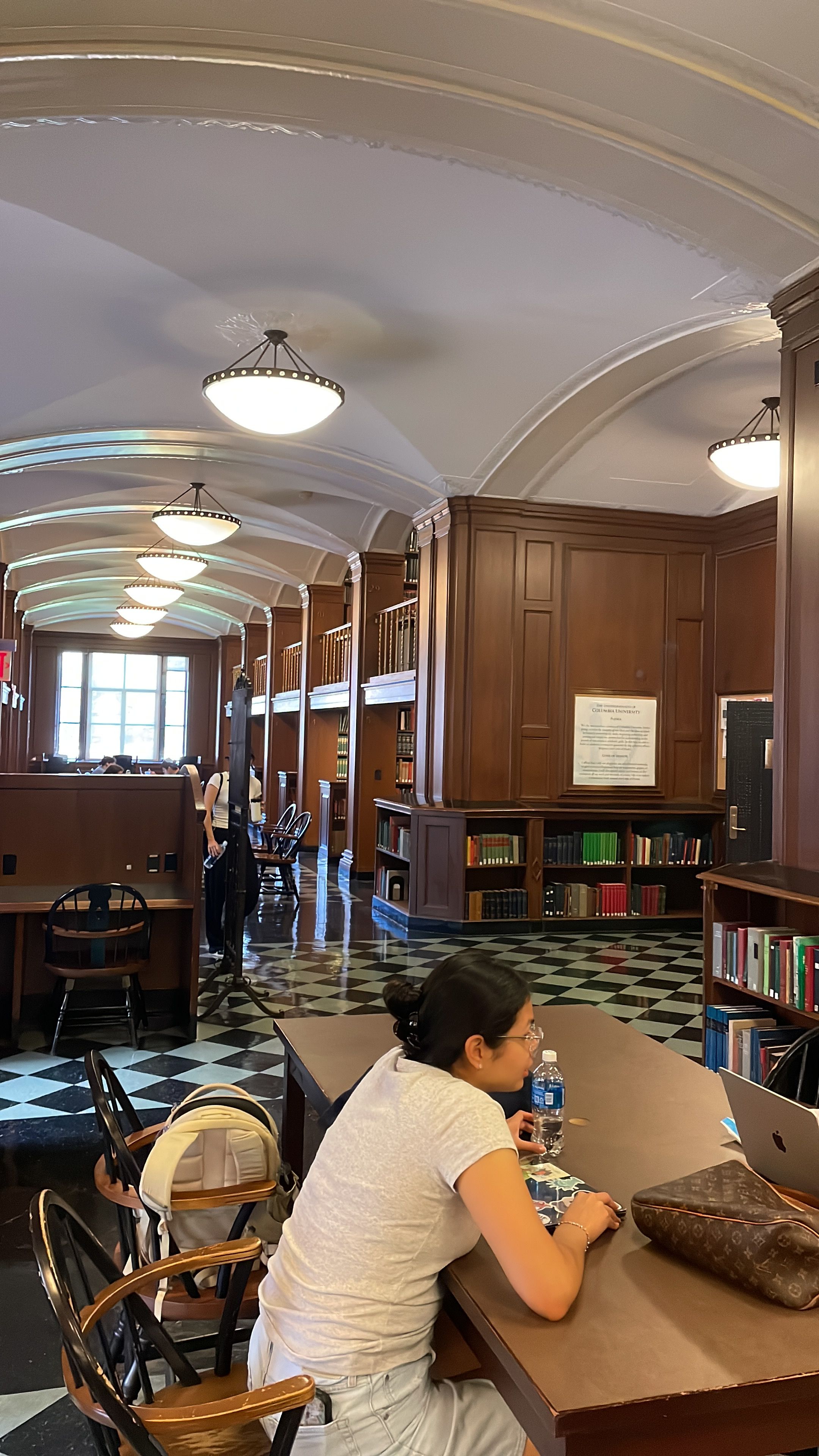 Bro’s flexing aura in a library, but laptop’s on TikTok.