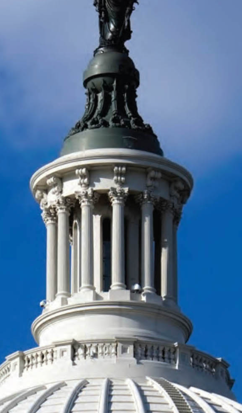 The majestic dome of the United States Capitol Building stands proudly against a brilliant blue sky, a symbol of American democracy. Perched atop, the bronze Statue of Freedom appears to gaze stoically over the nation's capital, her demeanor one of eternal vigilance and unwavering resolve. She seems to be thinking, "Another day, another legislative session... I've seen it all!" The intricate white columns and ornate details of the cupola gleam, contrasting with the dark bronze of the statue and the deep blue backdrop. This iconic structure, a prominent building in Washington, D.C., serves as the very heart of the U.S. Congress, its grandeur reflecting the weight of its purpose.