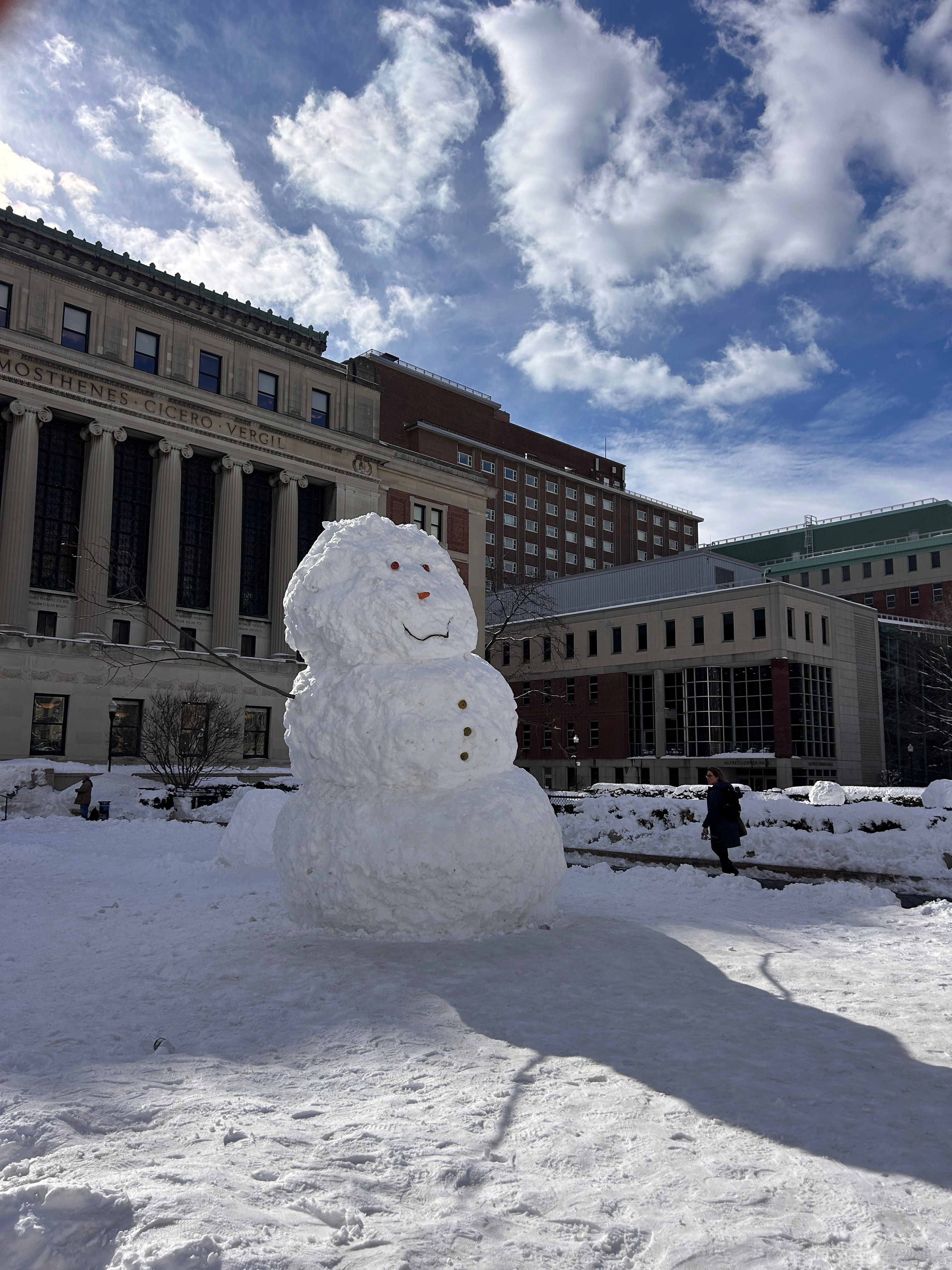 Snowman’s got Unc Status, chilling by Butler like a legend.