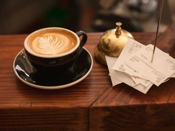 Sipping coffee like Sisyphus, receipts as my tiny faithful boulder