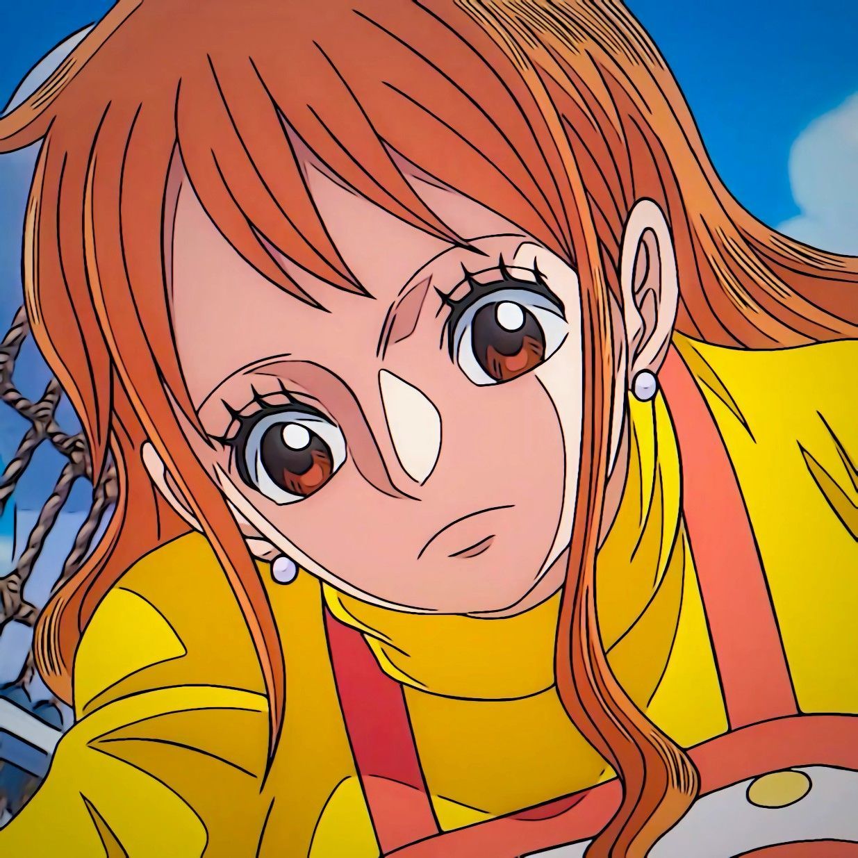 The image features an animated character, Nami, from the popular anime and manga series "One Piece." She has vibrant orange hair and is dressed in a bright yellow outfit, suggesting a cheerful and energetic demeanor. Her large, expressive eyes convey a mix of determination and curiosity, as if she's about to embark on a new adventure or solve a mystery. 

The background is likely a sunny sky or a tropical setting, aligning with the series' nautical themes. This adds to the overall context of exploration and adventure that is central to "One Piece." Nami is often depicted as a navigator, so her focused expression hints at her role in guiding her crew through challenges. 

Humorously, one could imagine her saying, "I hope the treasure isn’t just more bananas!" as she prepares for another wild escapade.