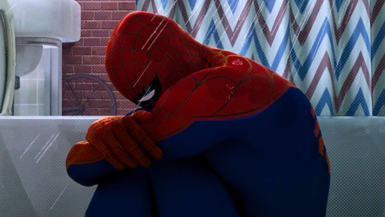 This poignant image captures Peter B. Parker, the weary Spider-Man from "Spider-Man: Into the Spider-Verse," slumped dejectedly in a shower, fully clothed in his iconic red and blue suit. Water streams down, mirroring his apparent despair and adding to the somber mood. His head is bowed, arms wrapped around his knees, conveying a profound sense of defeat and exhaustion. The background features a mundane bathroom setting with a brick-patterned wall and a chevron-striped shower curtain, emphasizing the relatable, almost domestic, nature of his superhero burnout. This scene is famously recognized as the "Sad Spider-Man in Shower" meme, humorously encapsulating universal feelings of failure and existential dread, even for a superhero.