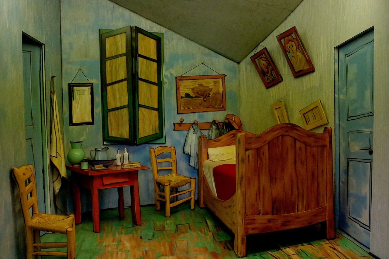 The image showcases a vibrant and stylized interpretation of Vincent van Gogh's iconic painting "The Bedroom." The room is characterized by its bold colors and unique perspective, emphasizing the warm wooden furniture, including a prominent bed, two chairs, and a small red table. The walls are adorned with paintings, and the bright green window frames create a striking contrast against the blue-toned walls.

The overall demeanor of the room feels inviting yet somewhat melancholic, reflecting van Gogh's personal space and emotional state during his time in Arles. The background elements, such as the angled ceiling and the open window, allow for a sense of depth and openness, while hints of nature can be seen through the window, symbolizing a connection to the outside world.

This artwork evokes a sense of nostalgia and intimacy, making viewers feel as if they are stepping into van Gogh's personal sanctuary, where every detail tells a story.